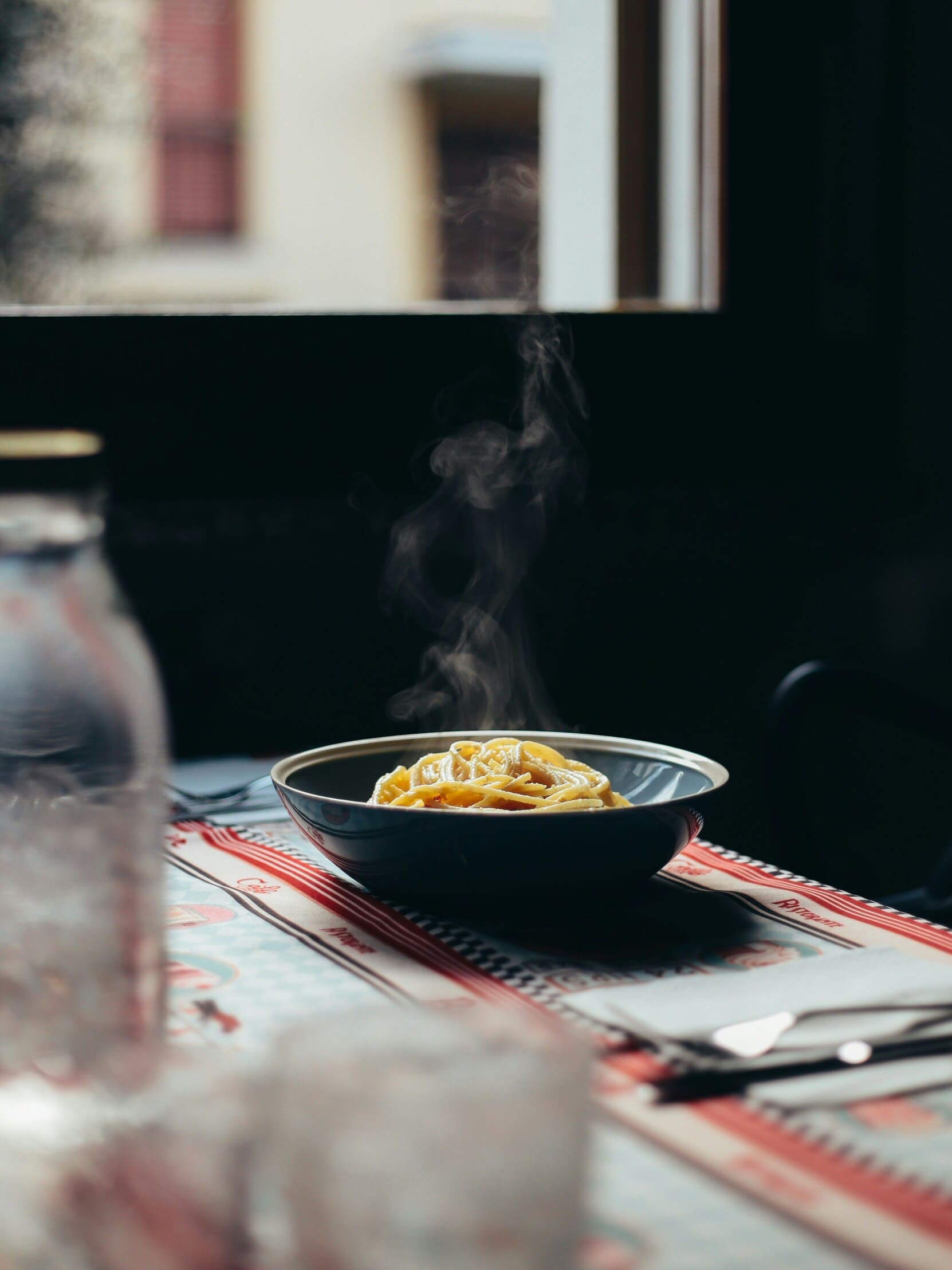 A plate of carbonara pasta on a table
